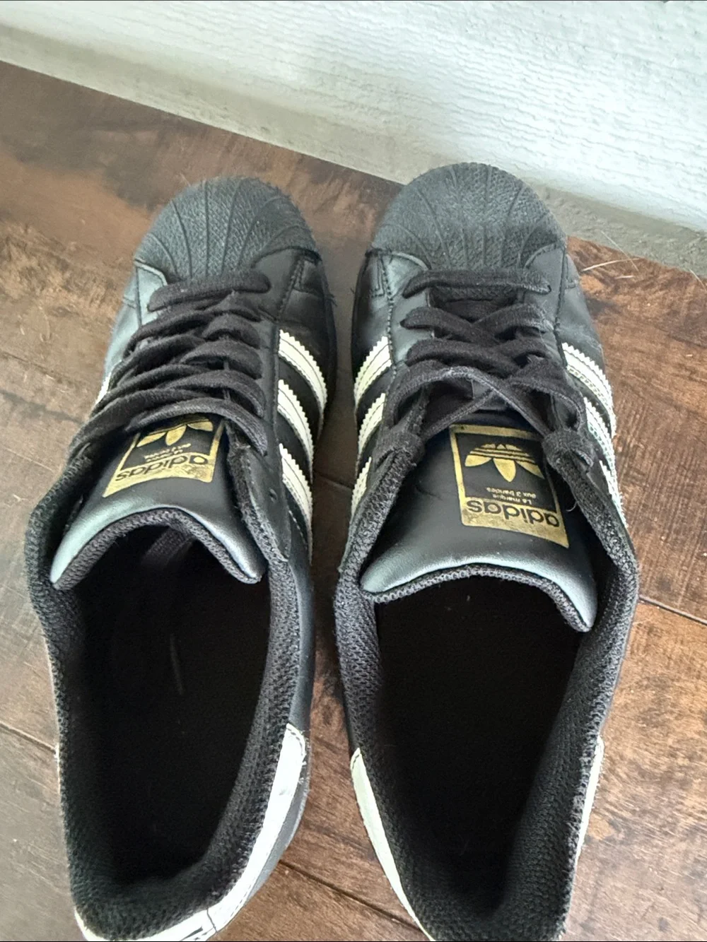adidas Black and White Classic Superstar Sneakers with Gold Tongue Logo